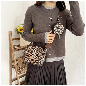 Detailed view of leopard print crossbody bag set with detachable round coin purse on shoulder strap