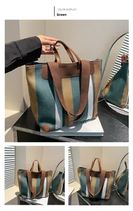 Détails du sac cabas en toile à rayures vertes avec poignées en cuir marron et coins renforcés