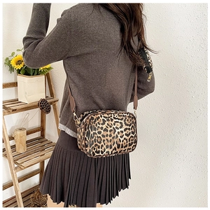 Leopard print crossbody bag set with adjustable strap and matching mini coin purse detail
