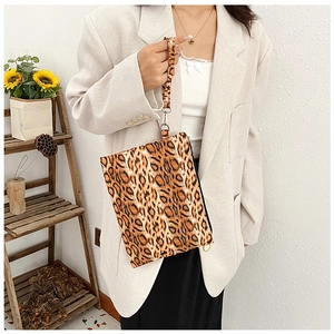 Fashionable leopard print clutch bag with detachable wrist strap and silver metal hardware