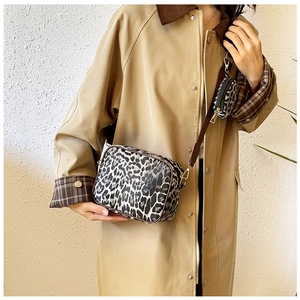 Detail of leopard print crossbody bag with mini round coin purse and gold hardware