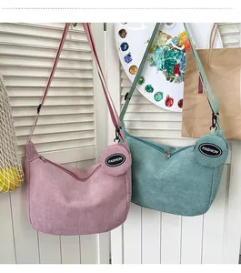 Pink and mint green corduroy crossbody crescent bags with matching round coin purses
