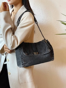 Retro washed black denim tote bag with metal chain strap and flap closure for women