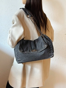 Retro black denim tote bag with chain strap and metal twist lock for casual daily commute