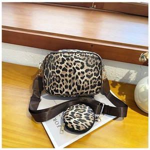 Detailed view of leopard print crossbody bag set with adjustable strap and round coin purse
