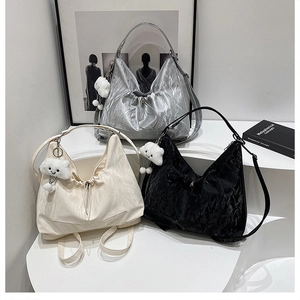 Three versatile large hobo bags in silver, beige, and black with cute cloud pendants