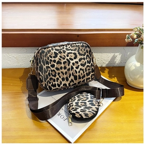 Detailed leopard print camera bag set with wide woven strap and gold metal hardware