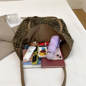 Spacious leopard print canvas tote bag showing large capacity for daily essentials