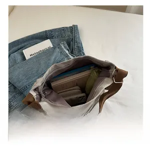 Internal view of cream canvas tote bag showing large capacity and multi-pocket structure