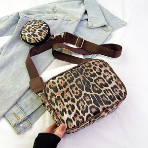 Leopard print crossbody travel cosmetic bag set with matching round pouch and wide strap