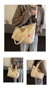 Detail view of large nylon tote bag with fashion label and secure zipper closure