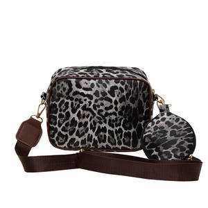 Leopard print crossbody bag set with round coin purse and adjustable brown strap