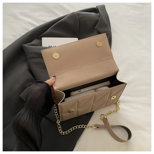 Quilted beige shoulder bag showing spacious interior for phone and cosmetics