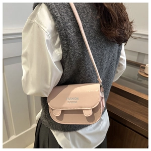 Detail showing the light pink PU leather crossbody bag with flap and decorative ears