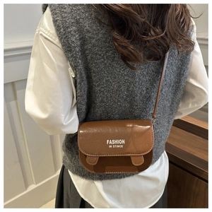 Brown faux leather crossbody bag with white fashion text print and flap closure detail