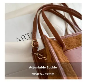 Macro detail of the adjustable buckle on a brown plush and PU leather handbag
