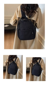 Détail d'un sac à dos minimaliste en nylon noir avec cordon de serrage latéral