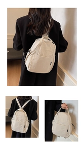 Détails du mini sac à dos crème montrant la grande poche avant et la poignée robuste
