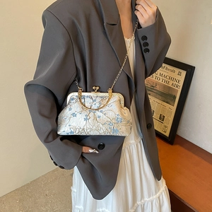 Elegant floral embroidery shoulder bag with gold metal frame and vintage clasp closure