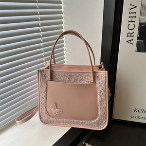Pink plush faux leather handbag with butterfly detail and detachable shoulder strap