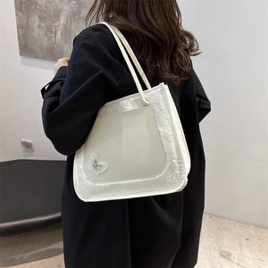 White faux fur and PU leather tote bag with butterfly embroidery and plush details