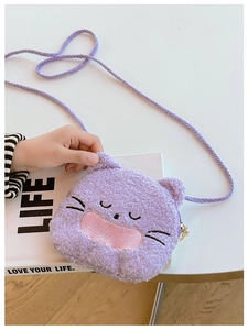 Detail of cute purple plush cat crossbody bag with soft faux fur texture and embroidery