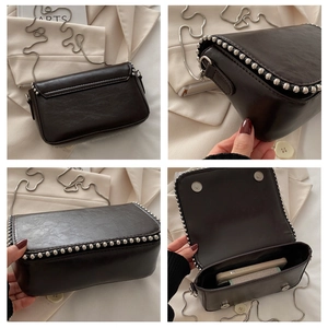 Detailed view of dark brown chain crossbody bag with silver rivet trim and magnetic closure