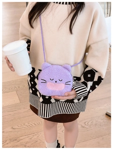 Detail of purple plush cat crossbody bag with soft faux fur texture and floral charm