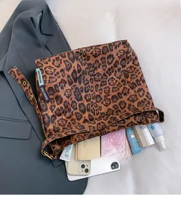 Leopard print tote bag interior showing spacious capacity for phone and cosmetics