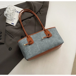Detail of wool-felt tote bag with brown leather trim and decorative knot drawstring
