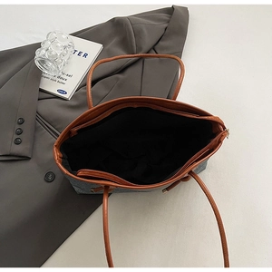 Top view of large wool-textured tote bag with brown handles and spacious interior structure