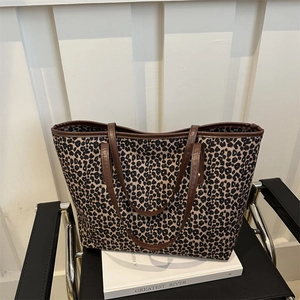 Fashionable leopard print tote bag with brown leather handles and large capacity