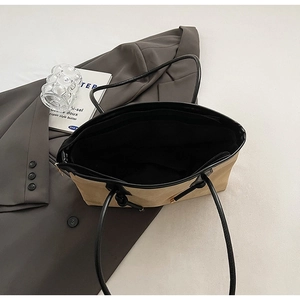 Top view of large khaki tote bag showing black lining and interior zipper pocket