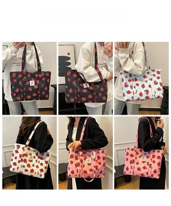 Collage of large strawberry print tote bags in black, blue, white, and pink options