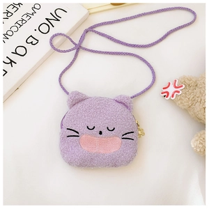 Detail of cute purple plush kitten crossbody bag with embroidery and gold petal zipper