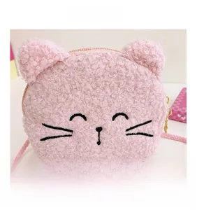 Close-up of pink plush cat bag featuring fine black embroidery and metal zipper detail