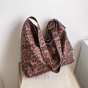 Vintage leopard print tote bag with wide shoulder strap and gold metal buckle