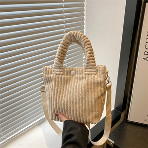 Cream corduroy bucket bag with spiral handle and adjustable shoulder strap for women