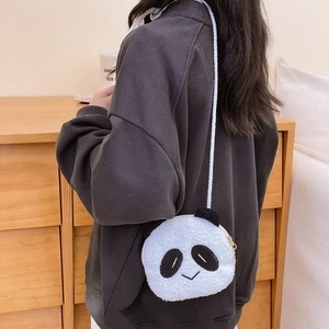 Cute panda plush crossbody bag with soft white sherpa fabric and woven shoulder strap