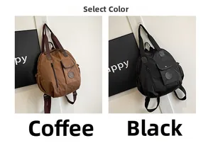 Detail view of large nylon backpacks in coffee and black colors for travel