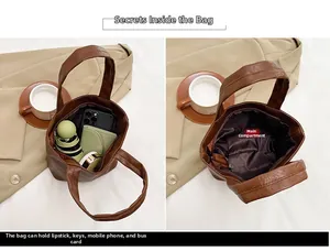 Detail showing the large capacity of the brown tote bag for daily essentials like phone and umbrella