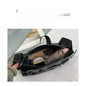 Interior view of black PU shoulder bag showing large capacity for daily essentials