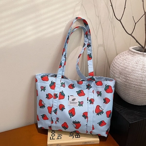 Light blue canvas tote bag with strawberry prints and sweet patterns for women