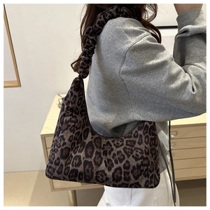 Detail of the leopard print hobo bag with a stylish ruched scrunchie shoulder strap
