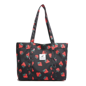 Large black strawberry print tote bag with double straps and durable fabric for daily use
