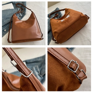 Detail of brown stitching bucket bag with vintage embroidery and adjustable silver buckle