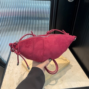Fashionable burgundy matte suede croissant bag with adjustable knot shoulder strap