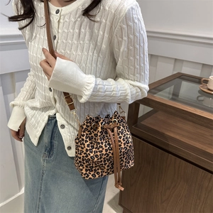 Chic leopard print drawstring bucket bag with leather strap for casual commute fashion