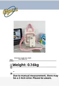 Detail view of pink and white nylon itabag showing clear display window and adjustable strap