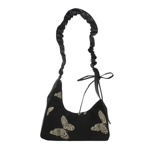 Black crescent moon hobo bag with gold butterfly embroidery and pleated handle
